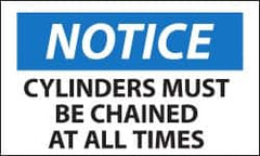 NMC - Accident Prevention Label, Header: NOTICE - Legend: Notice - Cylinders Must Be Chained at All Times, English, Black, Blue & White, 5" Long x 3" High, Sign Muscle Finish - Caliber Tooling