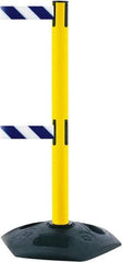 Tensator - 38" High, 2-1/2" Pole Diam, 4 Way Stanchion - 19" Base Diam, Octagon Recycled Rubber Base, Yellow Plastic Post, 13' x 2" Tape, Dual Line Tape, For Outdoor Use - Caliber Tooling