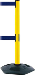 Tensator - 38" High, 2-1/2" Pole Diam, 4 Way Stanchion - 19" Base Diam, Octagon Recycled Rubber Base, Yellow Plastic Post, 13' x 2" Tape, Dual Line Tape, For Outdoor Use - Caliber Tooling