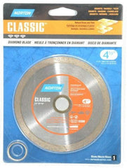 Norton - 4-1/2" Diam, 5/8 & 7/8" Arbor Hole Diam, Wet & Dry Cut Saw Blade - Diamond-Tipped, Standard Round Arbor - Caliber Tooling