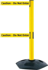 Tensator - 38" High, 2-1/2" Pole Diam, 4 Way Stanchion - 19" Base Diam, Octagon Recycled Rubber Base, Yellow Plastic Post, 7-1/2' x 2" Tape, Dual Line Tape, For Outdoor Use - Caliber Tooling